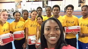Khamica Bingham Presents New Balance Shoes to BTC Athletes